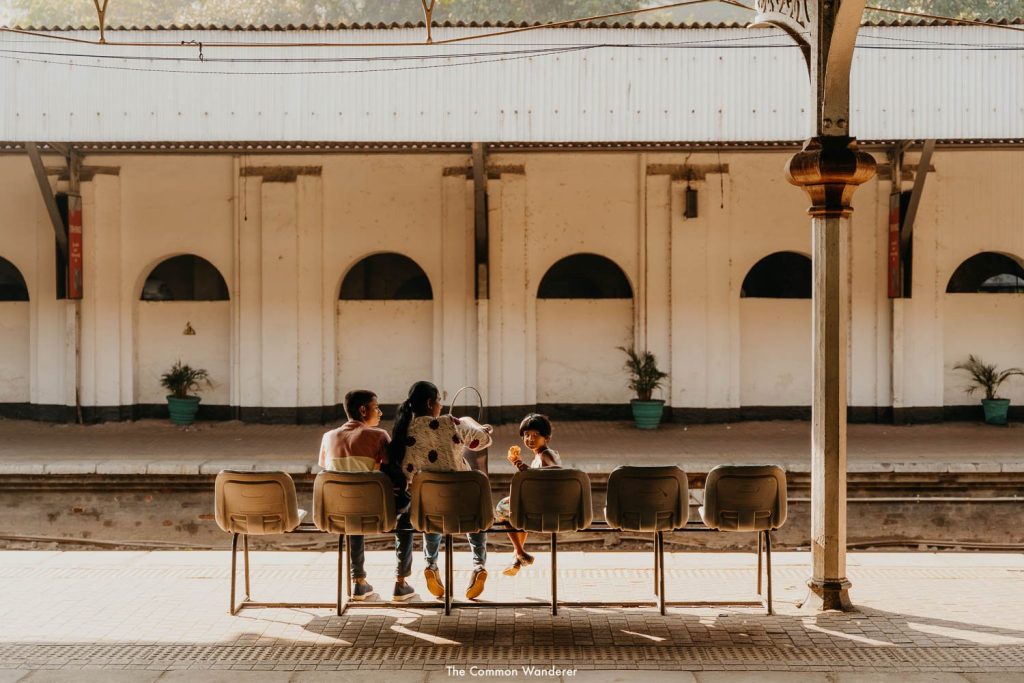 A family waiting at the railway station on a quiet morning